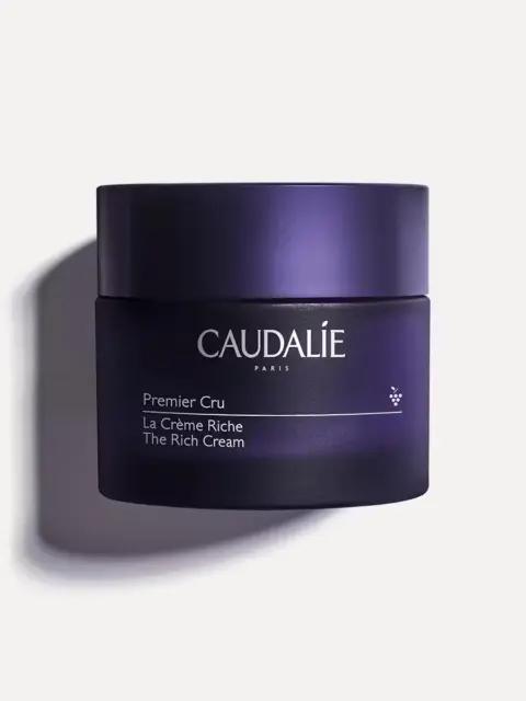 Dark purple jar labelled "Caudalie Premier Cru La Crème Riche The Rich Cream".