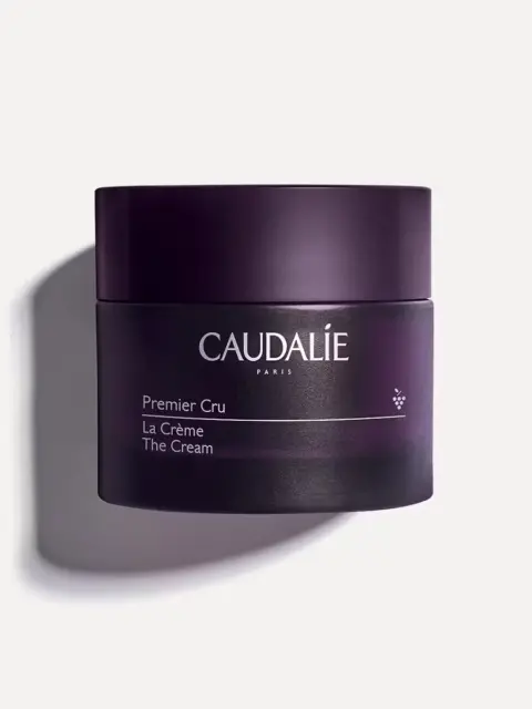 Caudalie Premier Cru La Crème in a dark purple jar on a white background.