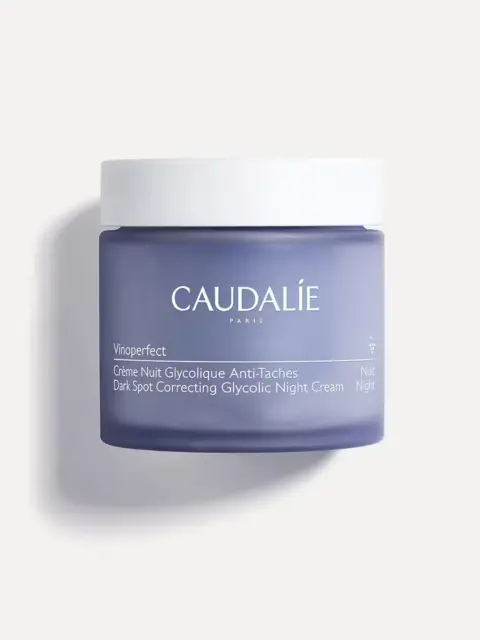 Caudalie Vinoperfect Dark Spot Correcting Glycolic Night Cream in a purple jar.