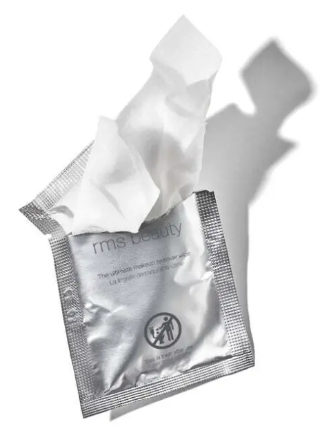 Silver packet of rms beauty makeup remover wipes, partially opened.