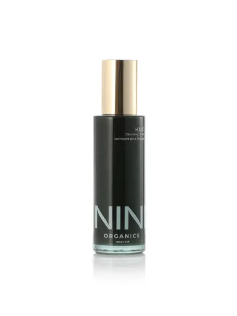 NIN Organics Halo Cleansing Elixir in a black bottle with a gold cap, 100ml.