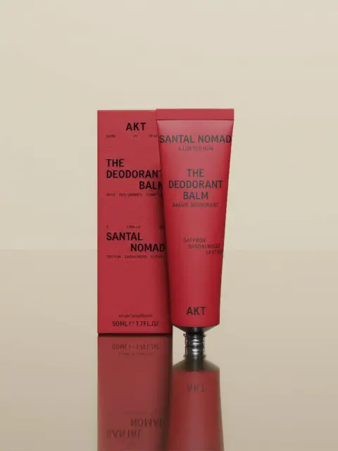 Red tube and box of AKT Santal Nomad deodorant balm, 50ml, with saffron, sandalwood, leather.