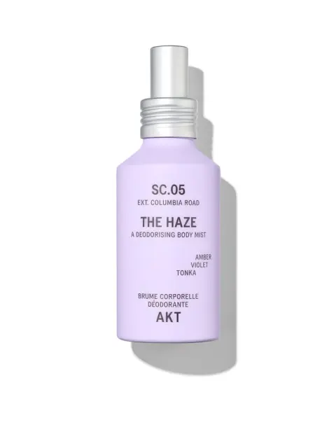 Lavender bottle of AKT The Haze deodorising body mist with silver cap.