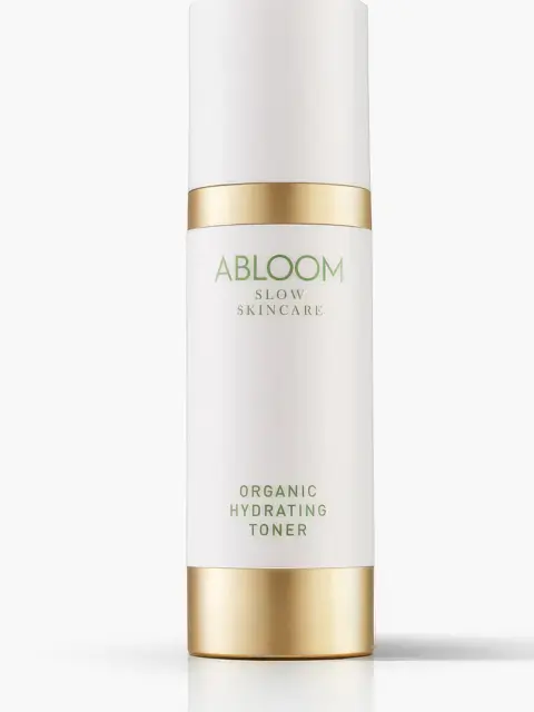 Abloom Organic Hydrating Toner bottle with gold accents on white background.