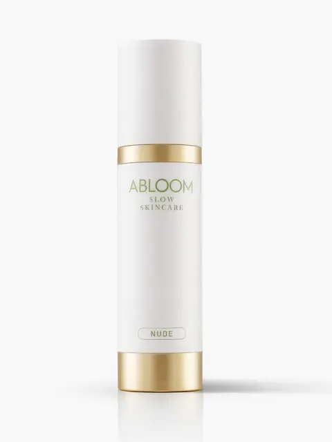 White and gold Abloom Slow Skincare bottle labelled "Nude".