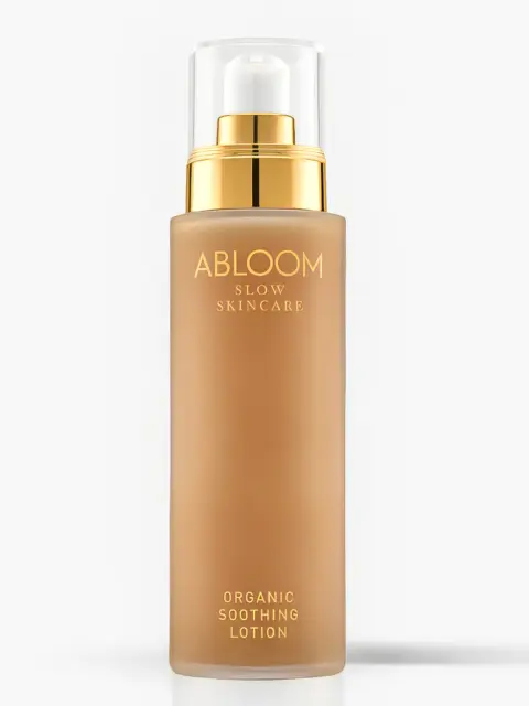 Abloom Slow Skincare Organic Soothing Lotion in a gold-capped bottle.