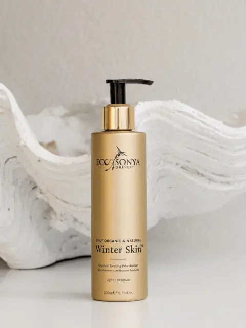 Eco by Sonya Winter Skin moisturiser bottle on white textured background.