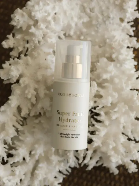 Eco by Sonya Super Fruit Hydrator bottle on white coral background.