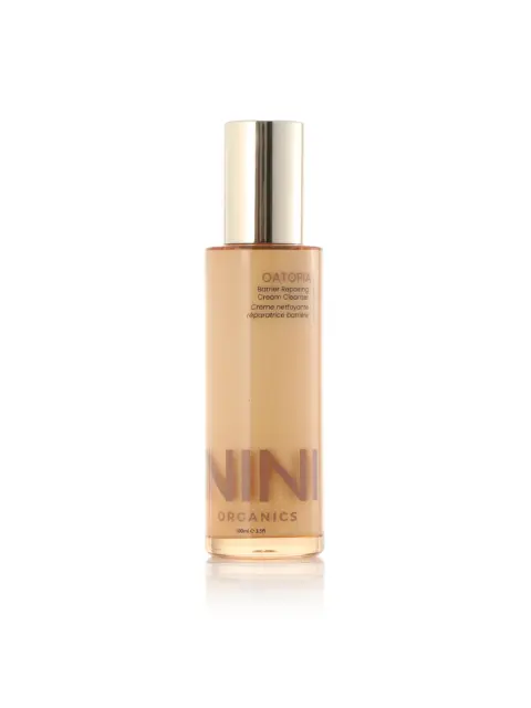 NINI Organics Oatopia Barrier Repairing Cream Cleanser, 100ml bottle with gold cap.