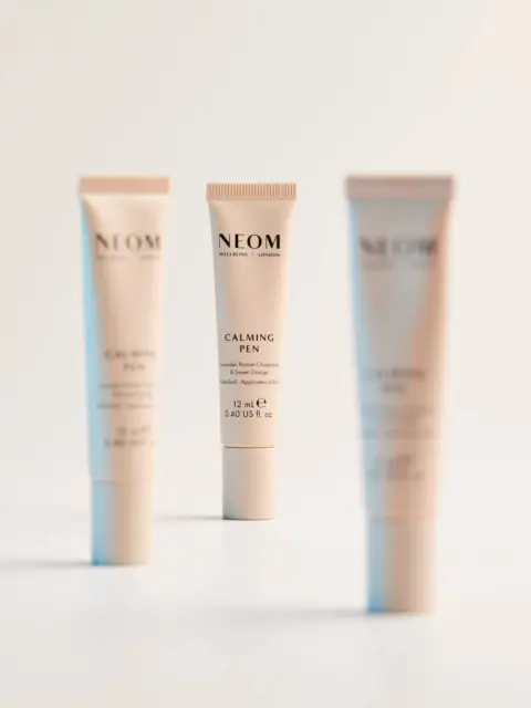 Three NEOM Calming Pen tubes on a white background.