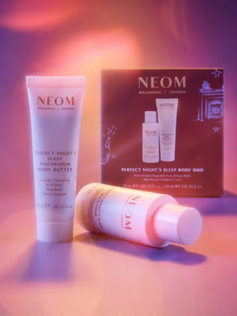 NEOM Perfect Night's Sleep Body Duo with body butter and oil against a purple background.