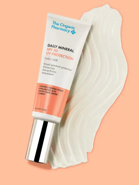 Tube of Daily Mineral SPF 30 on a peach background with cream swatch.