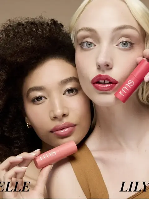 Two women holding pink rms beauty products, text "ELLE" and "LILY" below.