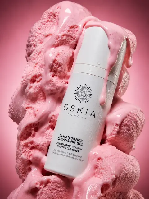 Oskia Renaissance Cleansing Gel bottle surrounded by pink foam.