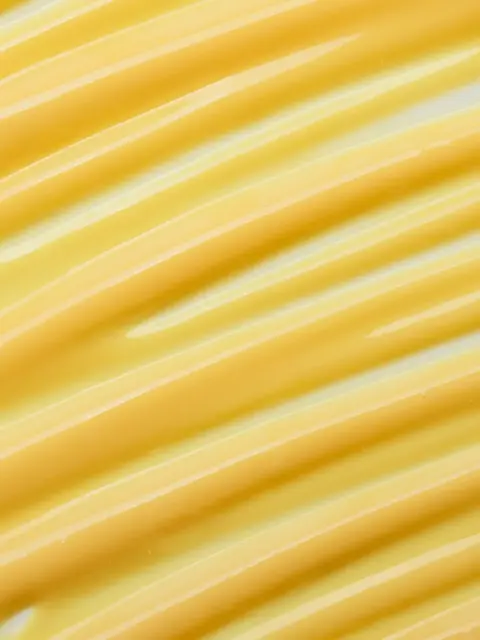 Yellow cream with smooth, wavy texture.