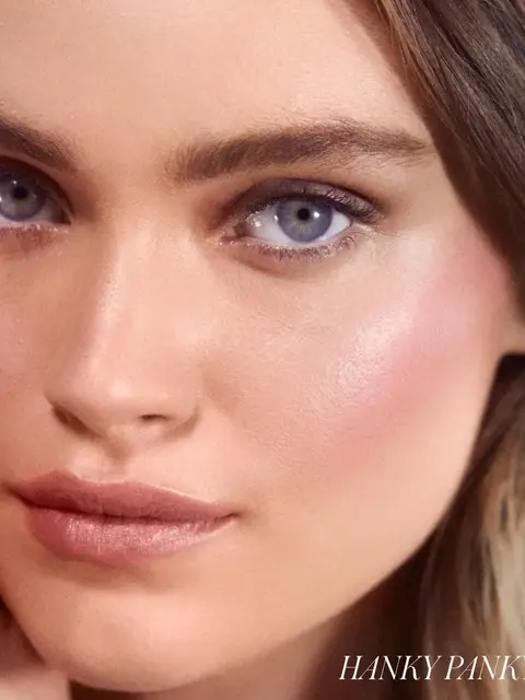 Close-up of a woman's face with natural makeup. Text: "HANKY PANKY" in the corner.