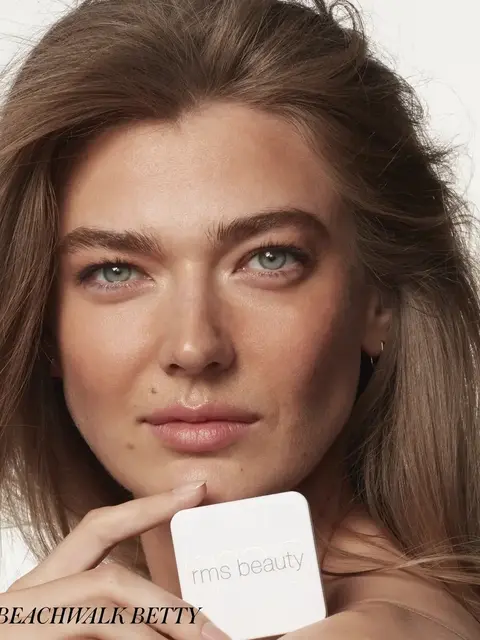 Person holding rms beauty product, text "BEACHWALK BETTY" in corner.