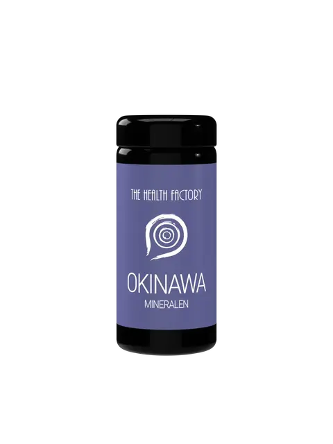 Black bottle with purple label, "The Health Factory Okinawa Mineralen" text and spiral design.
