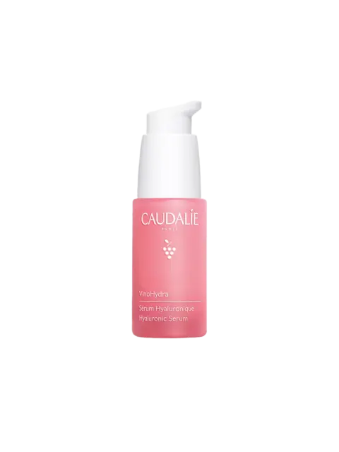 Caudalie VinoHydra Hyaluronic Serum in a pink bottle with a white pump.