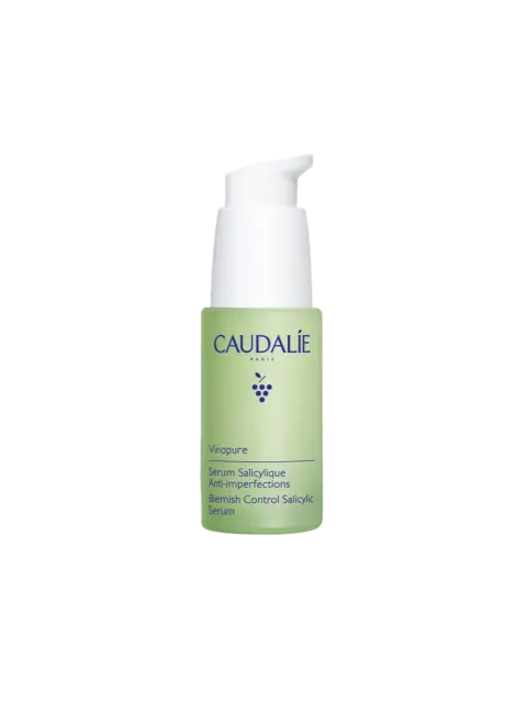 Caudalie Vinopure Blemish Control Salicylic Serum in a green pump bottle.