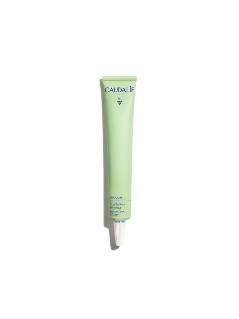 Caudalie Vinopure Salicylic Spot Solution in a green tube.