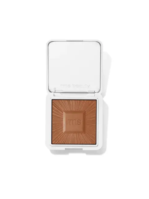 Open compact with brown powder and "rms" embossed, white case.