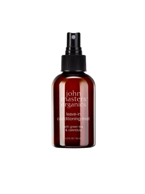 Brown spray bottle labelled "john masters organics leave-in conditioning mist".