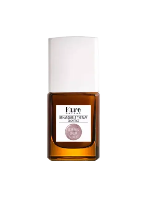 Kure Bazaar nail serum bottle with white cap and brown glass.