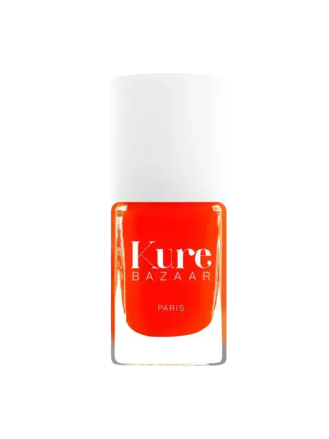 Kure Bazaar Paris nail polish in bright orange with a white cap.