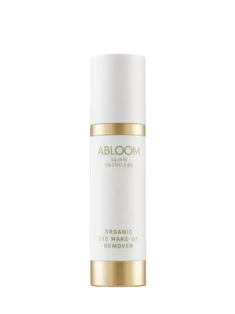 White bottle with gold accents labelled "Abloom Slow Skincare Organic Eye Make-up Remover".