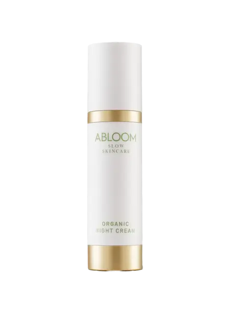 White bottle of Abloom Organic Night Cream with gold accents.