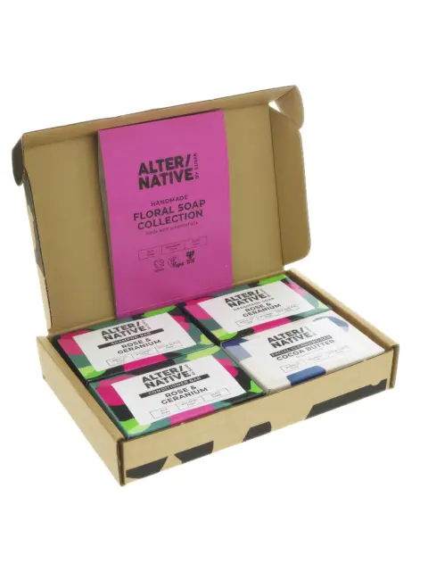 Open box with four bars of soap labelled "Rose & Geranium" and "Cocoa Butter".