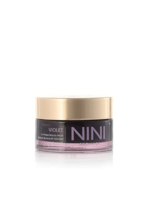 NINI Organics Violet Tri-Phase Beauty Mask in a clear jar with a gold lid.