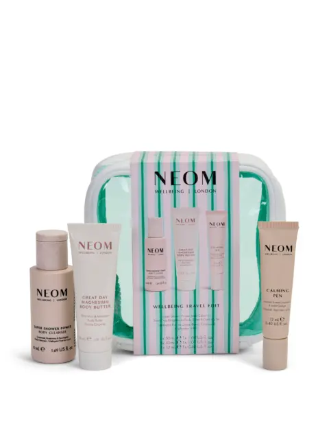NEOM Wellbeing Travel Edit set with body cleanser, body butter, and calming pen.