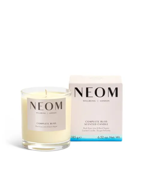 NEOM Complete Bliss scented candle with box, blush rose, lime, and black pepper scent.
