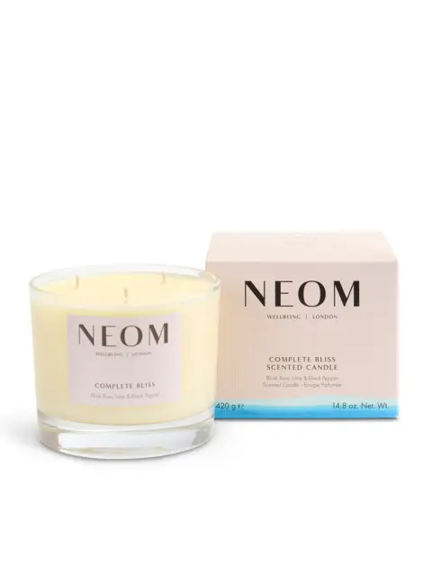 NEOM Complete Bliss scented candle with box, blush rose, lime, and black pepper scent.