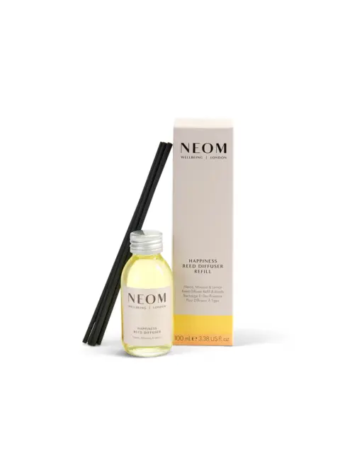 NEOM Happiness reed diffuser refill with reeds and packaging.