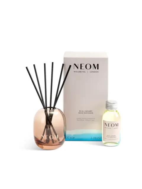 NEOM Real Luxury reed diffuser with bottle and packaging.