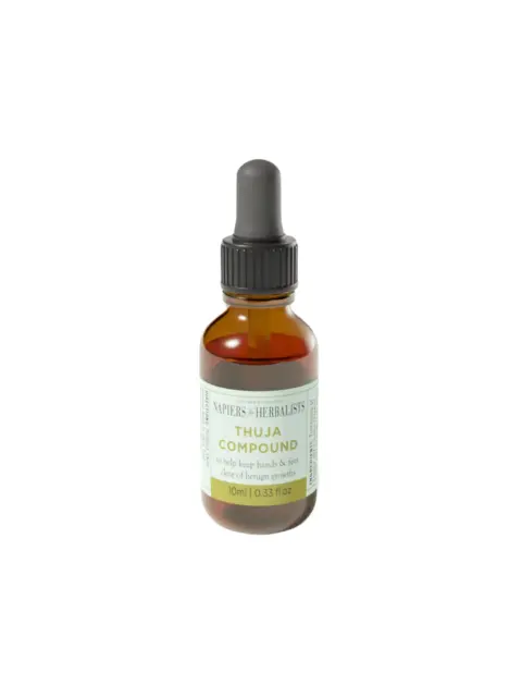 Brown glass bottle with dropper, labelled "Thuja Compound, 10ml, 0.33 fl. oz".
