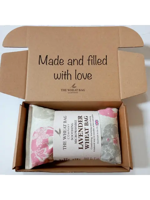 Lavender wheat bag in a box with "Made and filled with love" text on the lid.