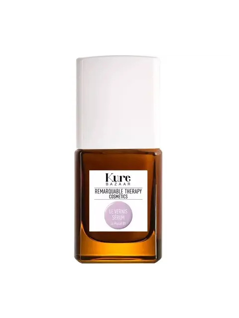 Brown bottle with white cap, labelled "Kure Bazaar Remarkable Therapy Cosmetics Le Vernis Sérum".
