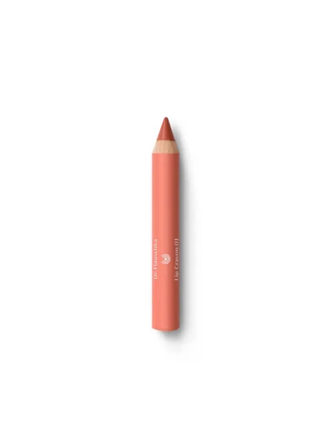 Coral lip crayon with "Dr. Hauschka Lip Crayon 01" text on white background.