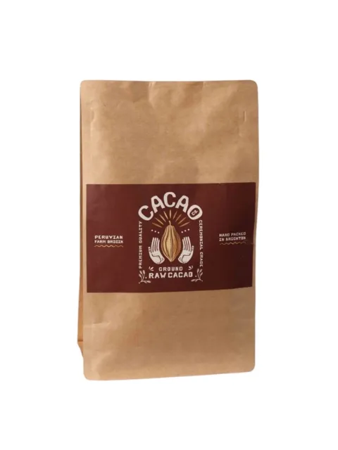 Brown paper bag of ground raw cacao, Peruvian origin, hand packed in Brighton.
