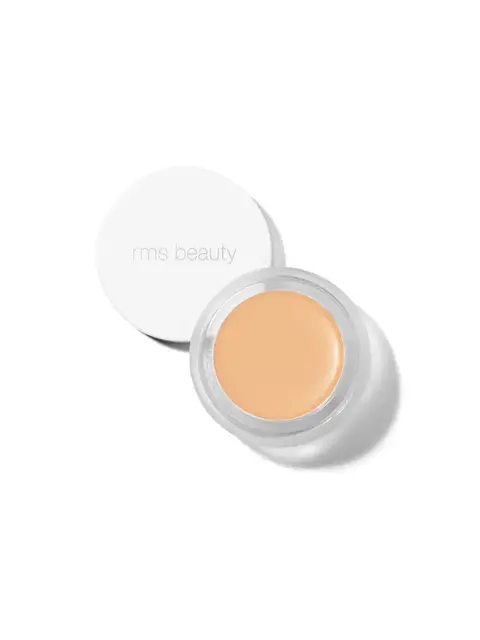 Open jar of rms beauty concealer with white lid.