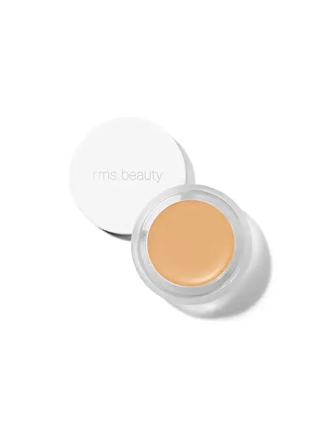 Open jar of beige cream with "rms beauty" on the lid.