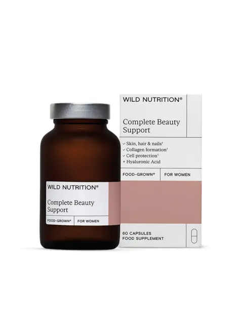 Brown bottle and box of Wild Nutrition Complete Beauty Support capsules for women.