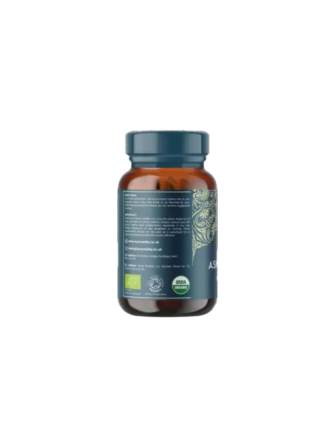 Brown bottle with blue label, organic certification logos, and contact details for Ayurvedic company.