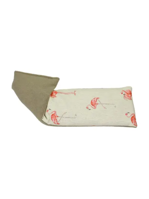 Cream eye pillow with pink flamingo pattern and brown fleece backing.