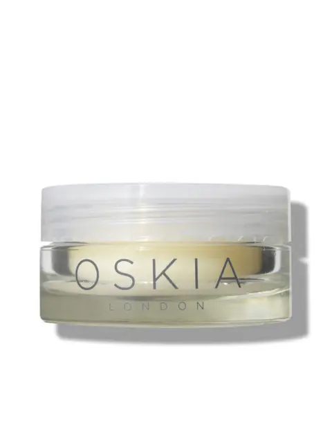 Clear jar of Oskia London skincare cream with white lid.