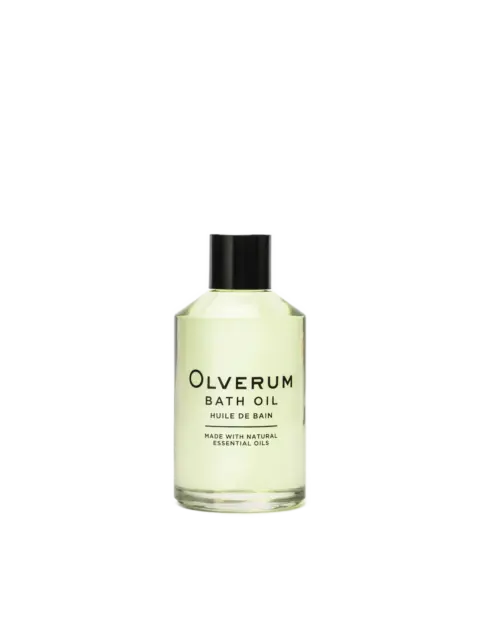 Clear bottle of Olverum bath oil with black cap.